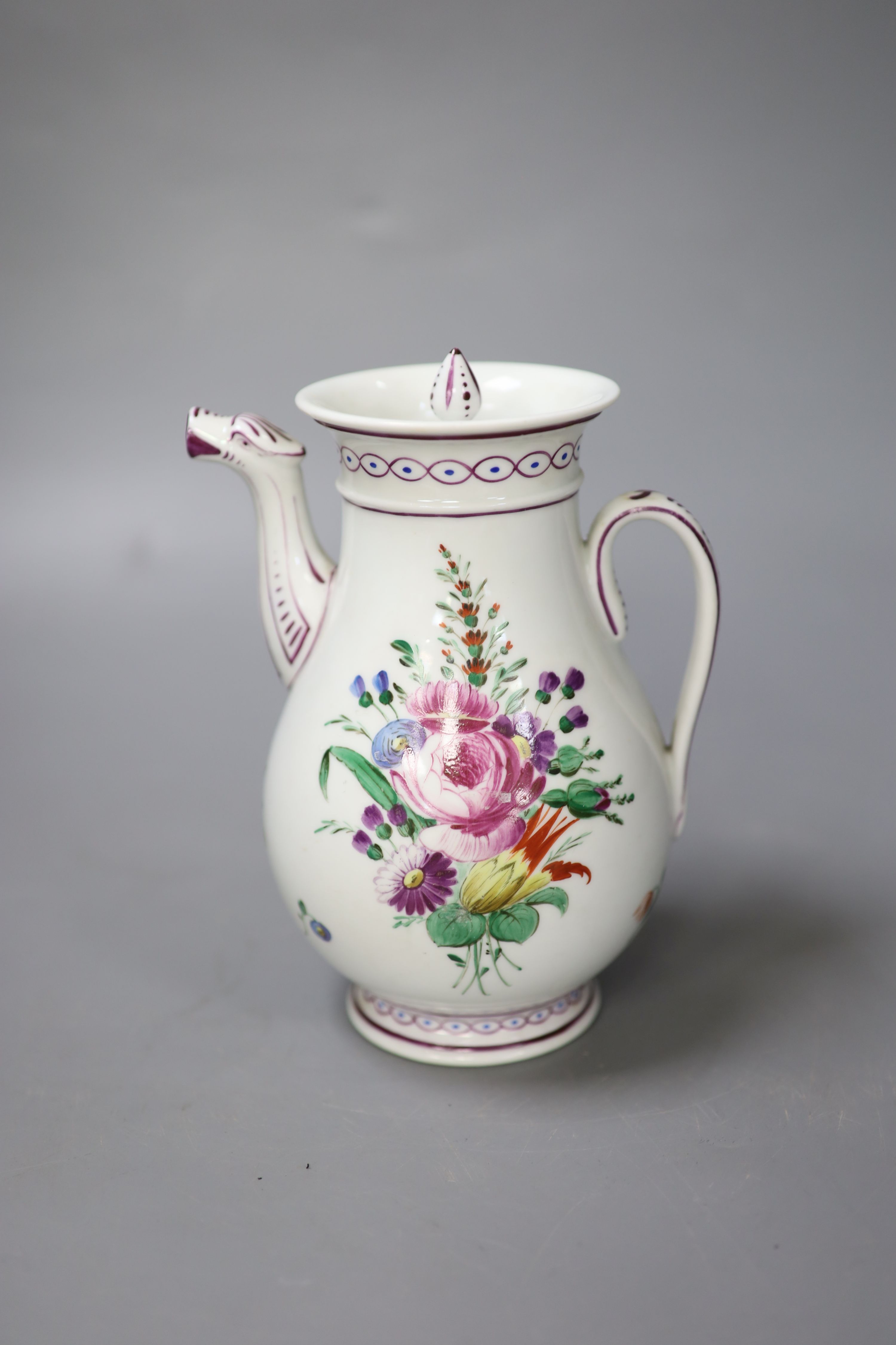 An 18th century Continental coffee pot and cover painted with flowers probably Vienna, impressed 84, 18cm high